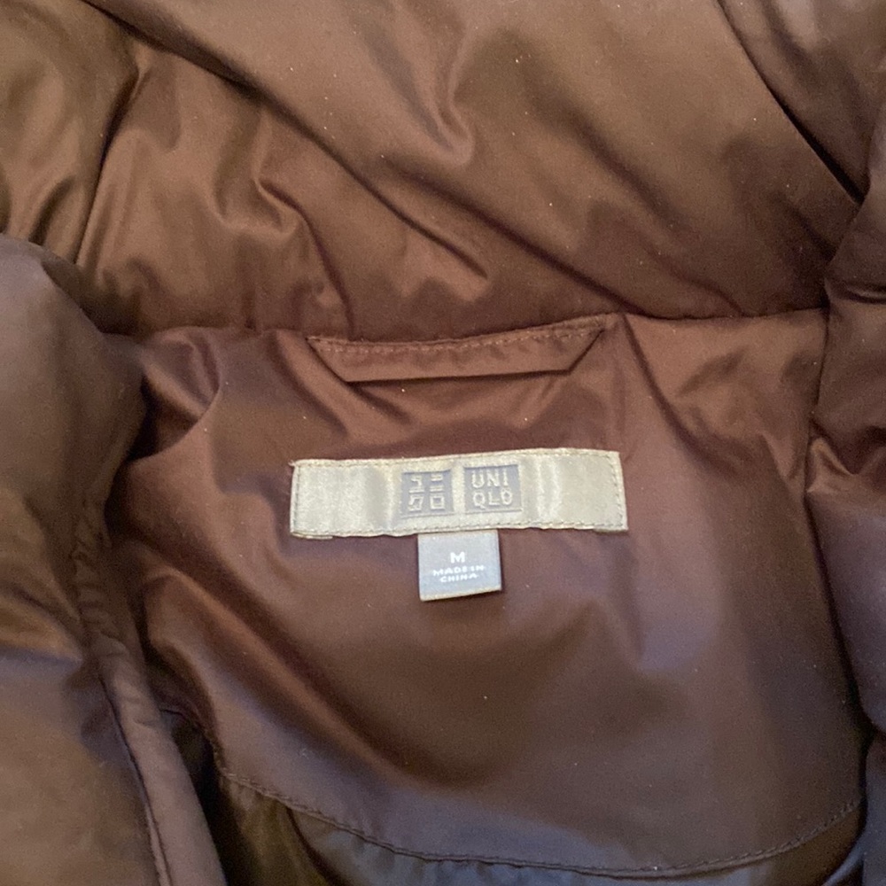Uniqlo brand long puffy coat with belt.